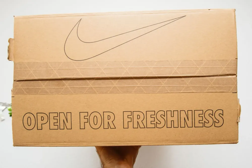 Nike unboxing featuring colourful packaging and a handwritten-style message card, adding a personal touch to the delivery experience